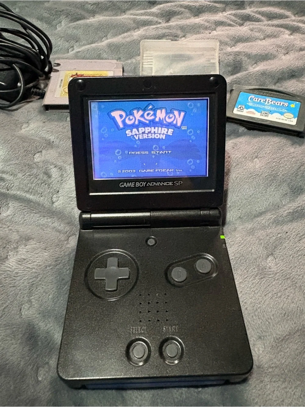 Nintendo Game Boy Advance SP Black with Pokémon sapphire, Zelda, Care Bears